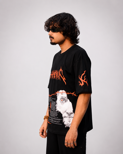 Side profile view of oversized drop shoulder black graphic t-shirt showing flame sleeve print and ribbed collar.