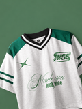 Front view of model wearing TNGS white and green sporty drop shoulder crop top with Made You Look Twice typography.
