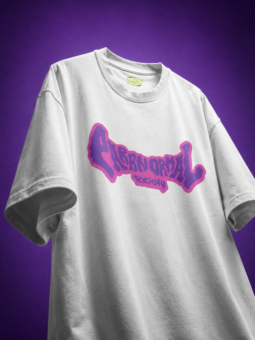 Front view of TNGS Clothing Paranormal Society white oversized drop shoulder t-shirt with purple front typography logo.