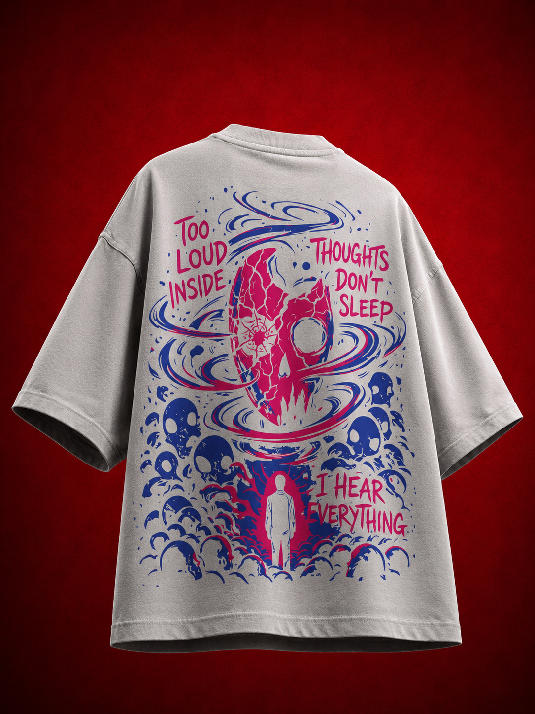 Back view of grey streetwear t-shirt featuring pink cracked skull, thought typography, and swirling blue vortex graphic.
