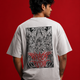 Model wearing white 180 GSM drop shoulder Attack On Titan anime graphic t-shirt with manga back print.