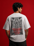 Model wearing white 180 GSM drop shoulder Attack On Titan anime graphic t-shirt with manga back print.