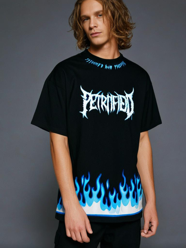 Black oversized streetwear T-shirt with blue flame design and bold gothic text – edgy fashion for metal and rock lovers.